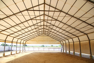 Empty riding arena is suitable for dressage horses