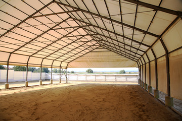 Empty riding arena is suitable for dressage horses