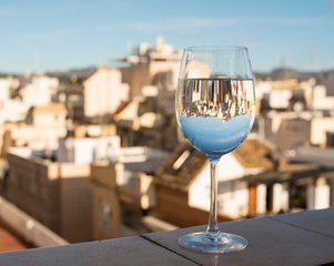 glass of water reflecting the city during covid 19