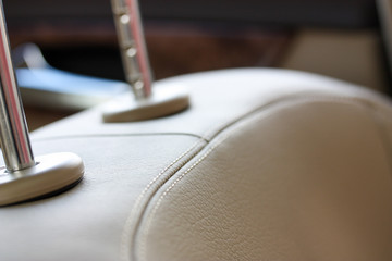 Macro of beige leather seat in luxury vehicle