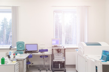 laboratory with modern equipment for blood analysis. The doctor checks the blood of patients. Blood test at a modern scientific workplace.