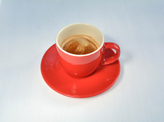 Black espresso coffee in a red cup.