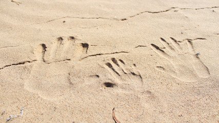 
drawings in the sand, sand, footprints in the sand,
