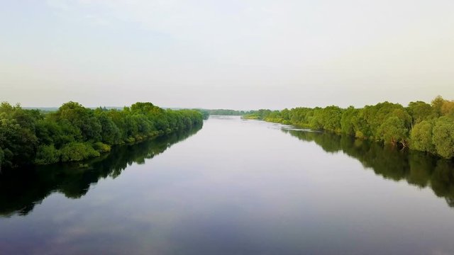 Flying along the riverbed. Beautiful Desna River in Ukraine. Aerial view.