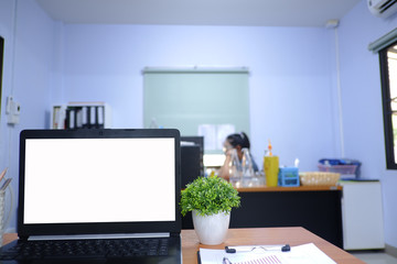 Cropped shot view of  white office desk table with the office equipments, alcohol sanitizer, face mask and other office supplies on the modern space, flat lay.work at home.