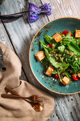 Obraz na płótnie Canvas Healthy appetizing tofu salad with vegetables