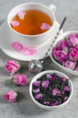 Cup of tea with rose petals