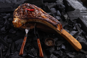 grilled tomahawk steak on wooden plate ready for eat