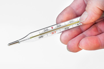 old woman holding a mercury thermometer which shows a high temperature