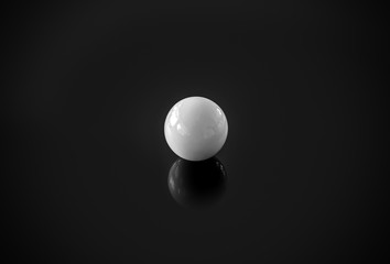 Minimalist's Delight, white sphere on shiny black surface