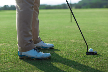 Golfer standing on field, playing golf on course  tee shot address.concept strengthens the body ,...