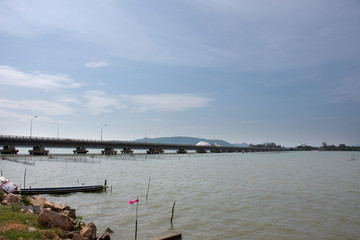 View landscape with cityscape of Hat Yai city and vehicle running on road Tinsulanonda Bridge crossing songkhla lake go to Ko Yo Island in Songkhla, Thailand
