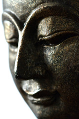A close up face of the buddha