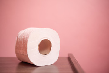 Close up toilet paper on  pink backgroud.