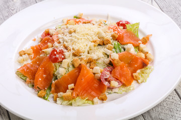 Caesar salad with salmon and parmesan