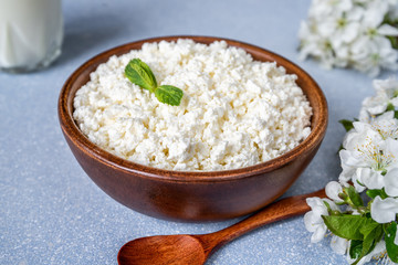 Cottage cheese in a wooden bowl