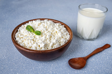 Cottage cheese in a wooden bowl