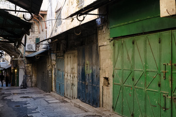Fototapeta na wymiar street in the old city blue and green gates Jerusalem Israel