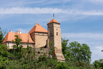 Fototapeta na wymiar Veveri castle is located in the Czech Republic. Fortress walls and towers on the hill.