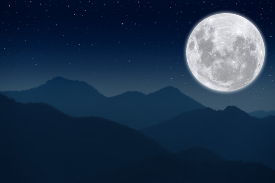 Full moon on the sky over the mountains. © Onkamon