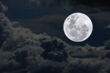 Fototapeta na wymiar Full moon and clouds on the sky.