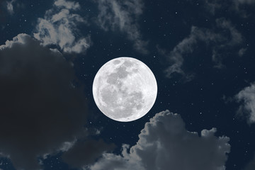 Fototapeta na wymiar Full moon and clouds in the sky.