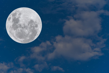 Naklejka na ściany i meble Full moon with clouds on the blue sky.