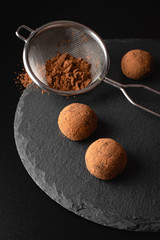 Chocolate truffles on a slate plate