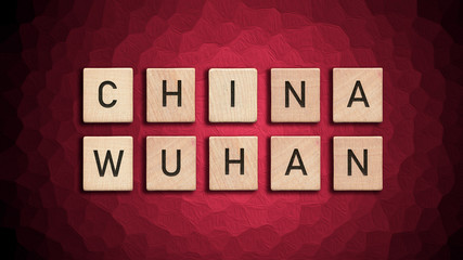 China Wuhan written with wooden tiles over red background