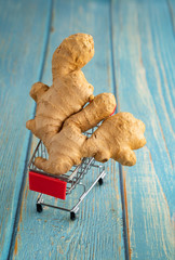 the ginger root in the toy shopping cart