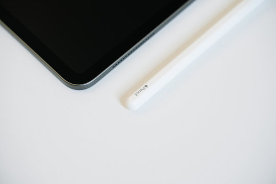 Nonthaburi, THAILAND - April 21, 2020 : Close-up image of New Apple Pencil (2nd Generation) with iPad Pro 12.9 inch 2020 on white table.