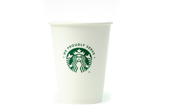 Seattle, WA, US 17.04.2020 Disposable white paper cup with Starbucks logo isolated on white background, concept of globalism, no plastics movement