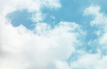 The blue sky with clouds, background