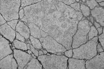 Cracked concrete floor texture background.
