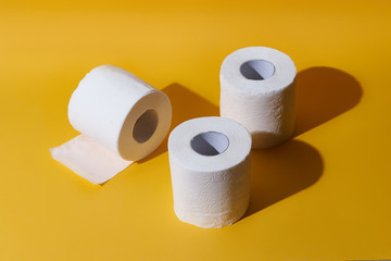 Creative still life with rolls of toilet paper, hot commodity during covid-19 and period of self...