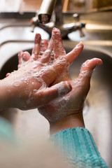 Fototapeta premium Woman washing hands. Wash hands with soap.