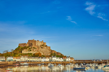 Image of Gorey harbour with Gorey castle in the background, Jersey Channel Islands