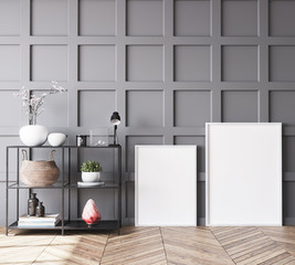 Empty frames in Scandinavian living room with gray wooden wall paneling, home decor