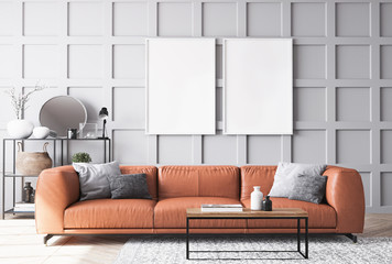 Orange leather sofa in Scandinavian living room with gray wooden wall paneling, home decor