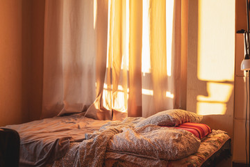 
flattened bed at home at sunset