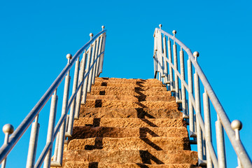 Sandstone stairs in the blue sky