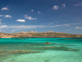 Panoramic view of the sunny beaches, and of the clear and transparent waters of the Maddalena island in Sardinia, Italy.