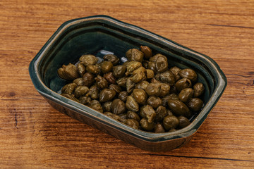 Tasty capers in the bowl