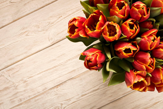 Bouquet of tulips on a light background. Concept image for a greeting card. Selective focus.