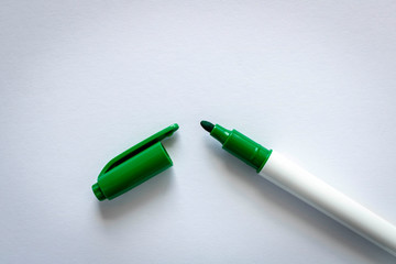 Green marker on a light background. Selective focus.