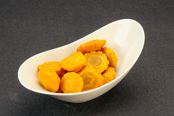 Marinated yellow patisson in the bowl