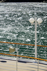 Ice floes broken off glacier in water in bay inside Glacier Alley in Patagonia seen from cruiseship...