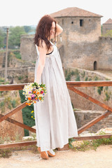 beautiful young woman walking on nature 