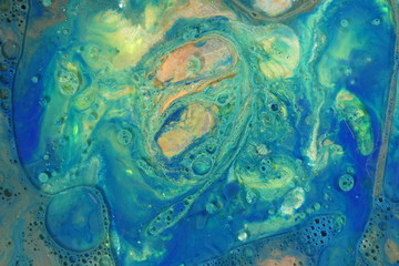 Abstract liquid ink marble color waves and bubbles