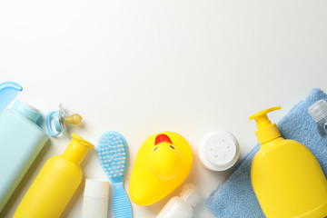 Baby hygiene accessories on white background, top view and space for text